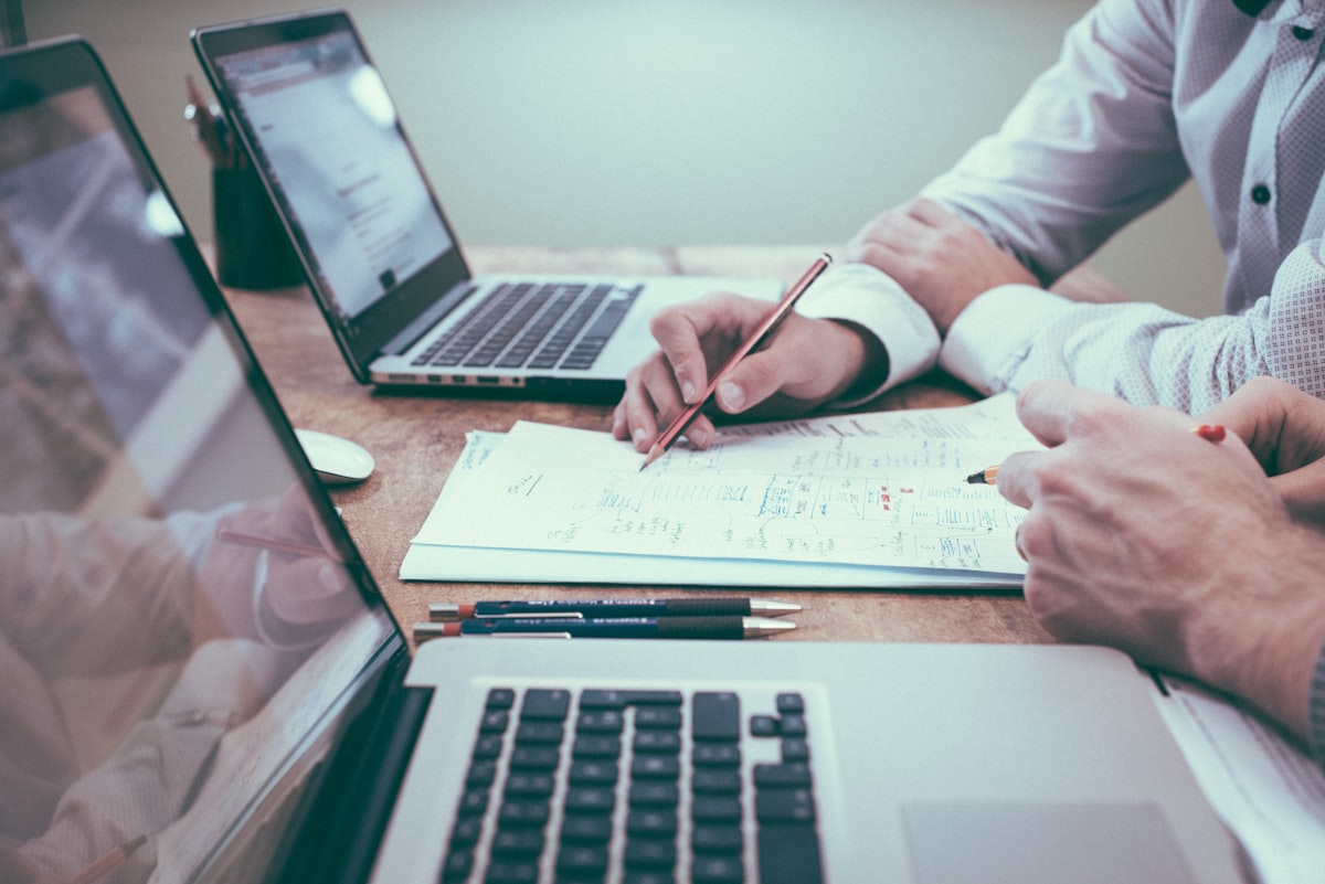 Business owner reviewing a strategy document and action list
