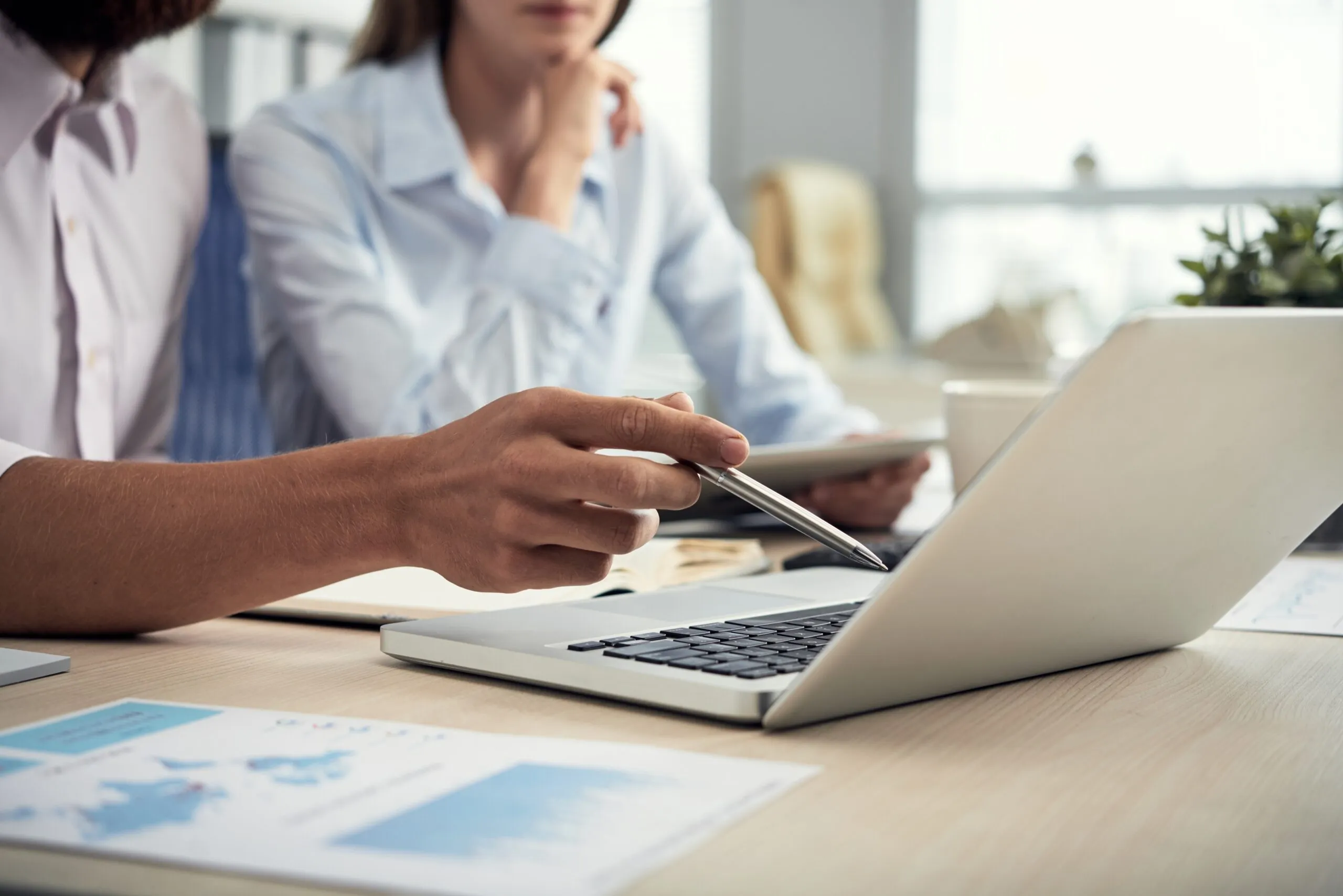 Independent consultant managing several client engagements on a laptop